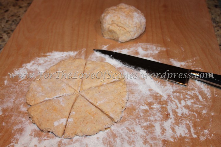 Flatten each half into a round and cut into six triangles.