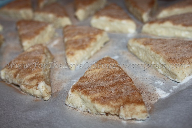 Press the sprinkled sugar lightly into the raw dough and spread the scones out to 1- to 2-inches apart.