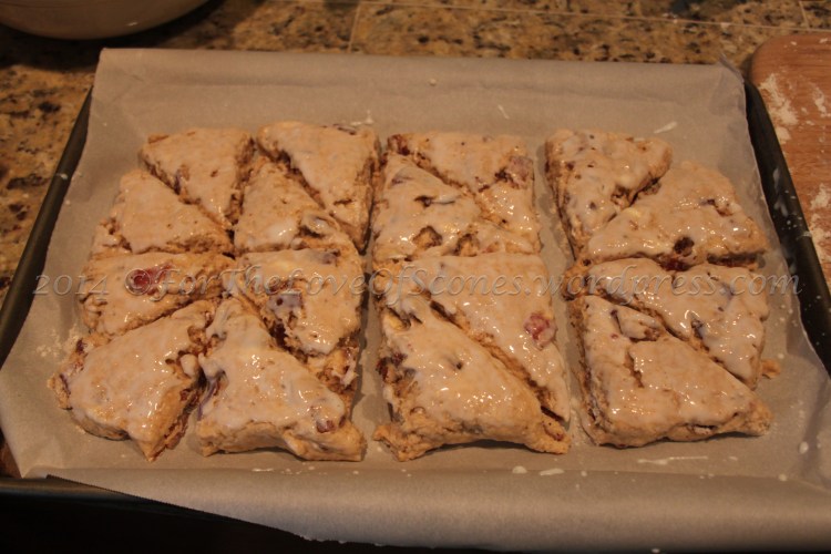 As I froze mine before baking, I put them all on a parchment-lined sheet and brushed with buttermilk before sticking them in the freezer to bake later.